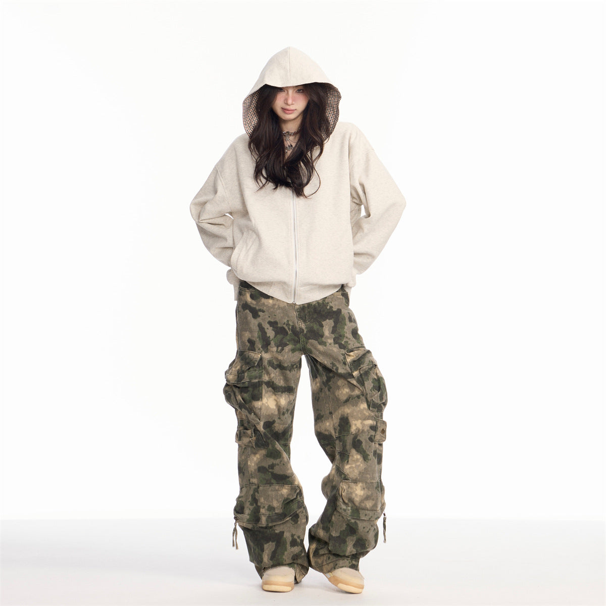 Washed and worn camouflage denim straight leg ripped slightly flared work pants with multiple pockets
