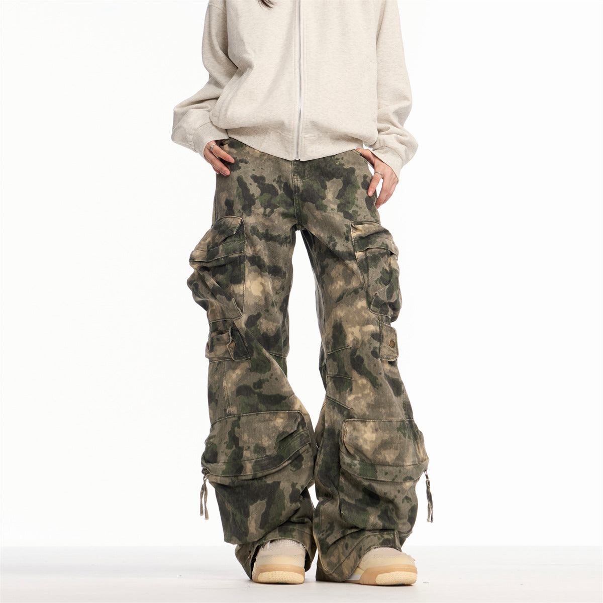 Washed and worn camouflage denim straight leg ripped slightly flared work pants with multiple pockets