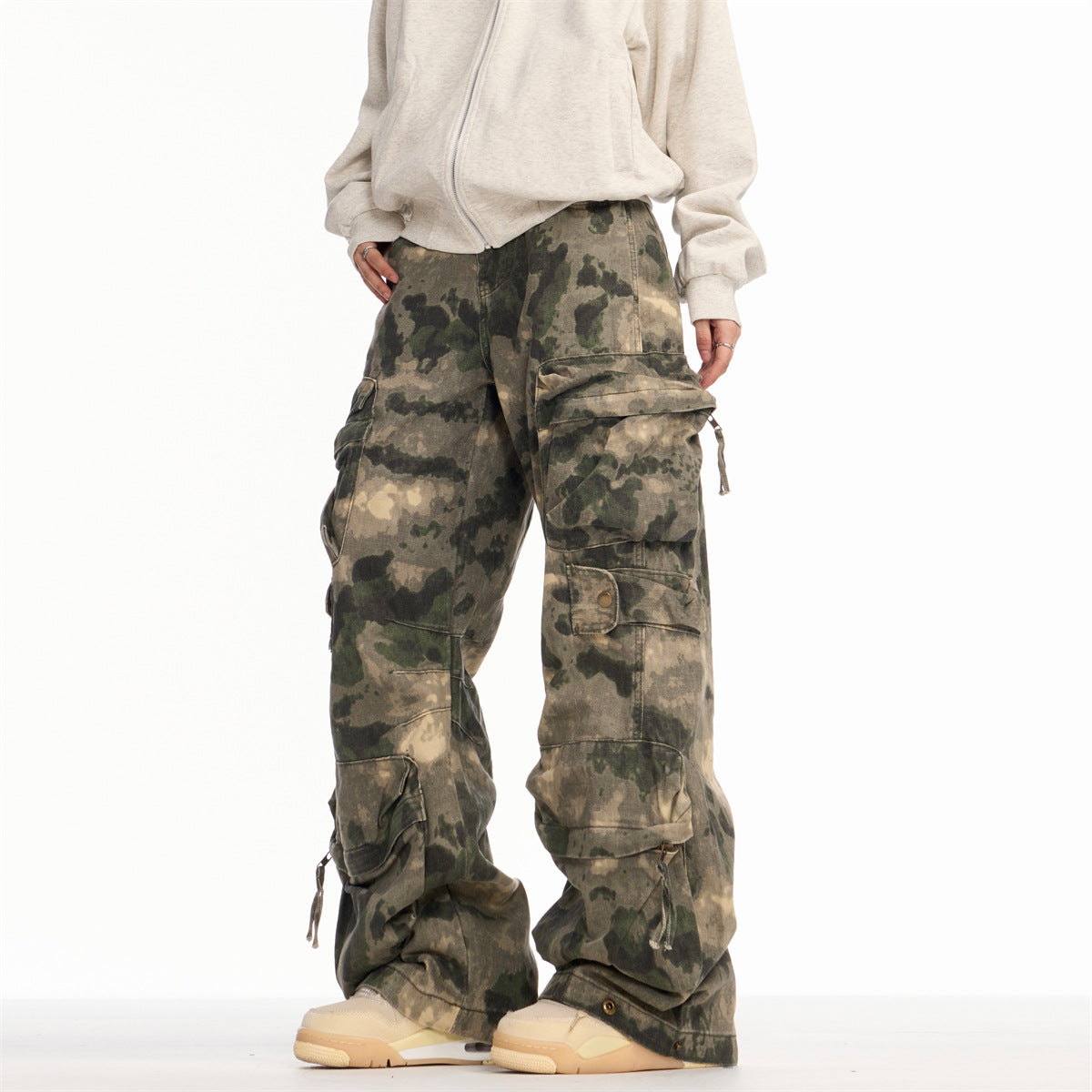 Washed and worn camouflage denim straight leg ripped slightly flared work pants with multiple pockets