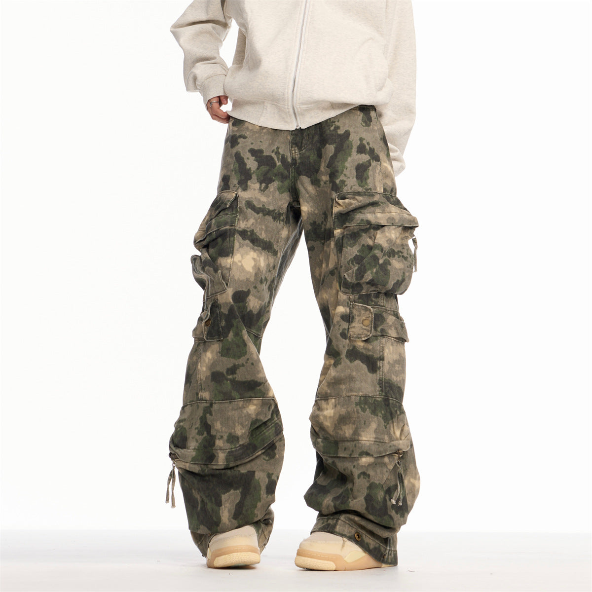 Washed and worn camouflage denim straight leg ripped slightly flared work pants with multiple pockets